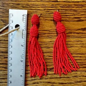 Fire red beaded tassel earrings.